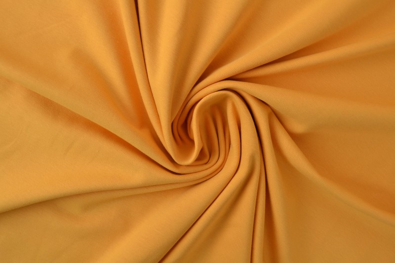 Katoen tricot okergeel